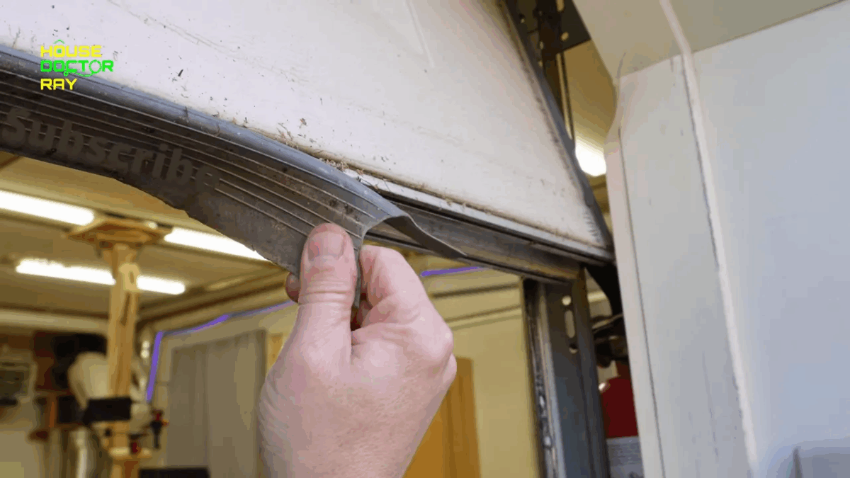 Close-up showing the shredded bottom seal and the groove where the new seal fits