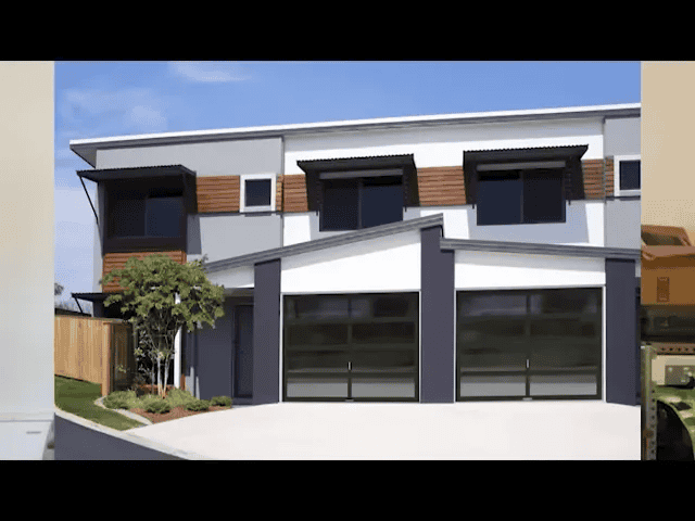 Full-view glass garage door installed on modern home