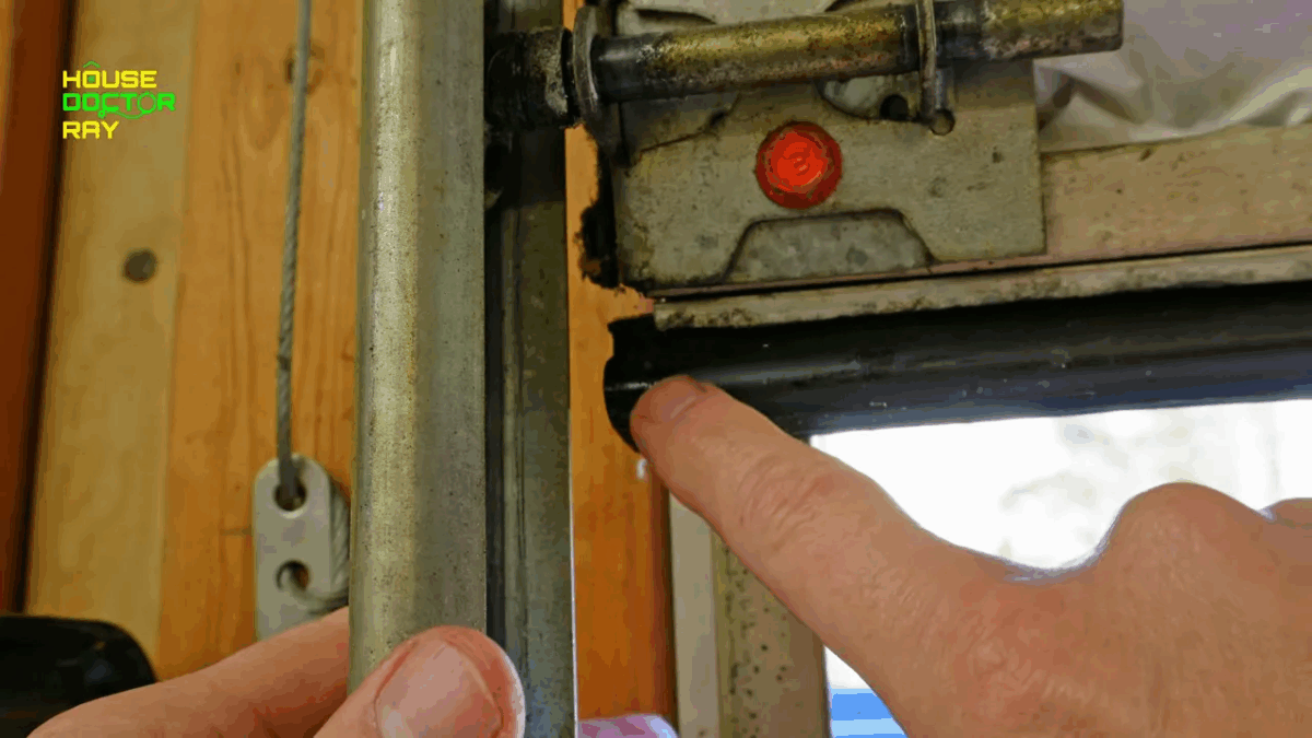 Seal protruding past the door edge ready to be trimmed